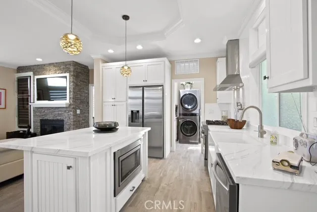 a kitchen with a sink stove and refrigerator