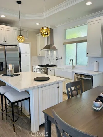 a kitchen with a table chairs and a stove