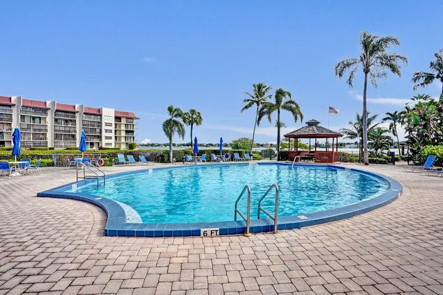 a view of a roof deck with couches and wooden floor