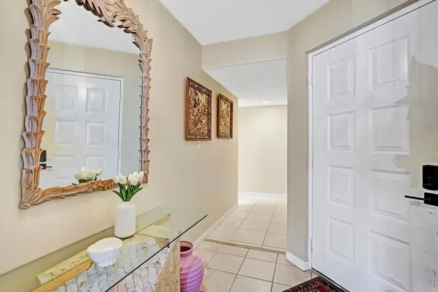 a view of a livingroom with furniture and front door