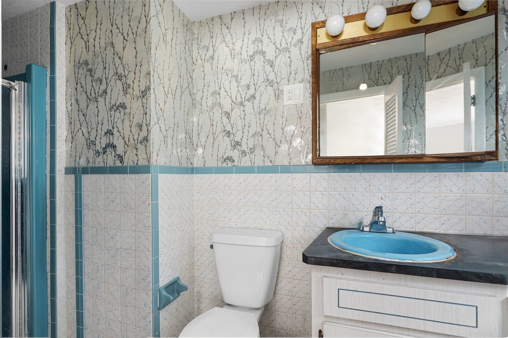 5 Richard Road Hingham, MA 02043 - Photo 8 of 12 a bathroom with a toilet sink and mirror