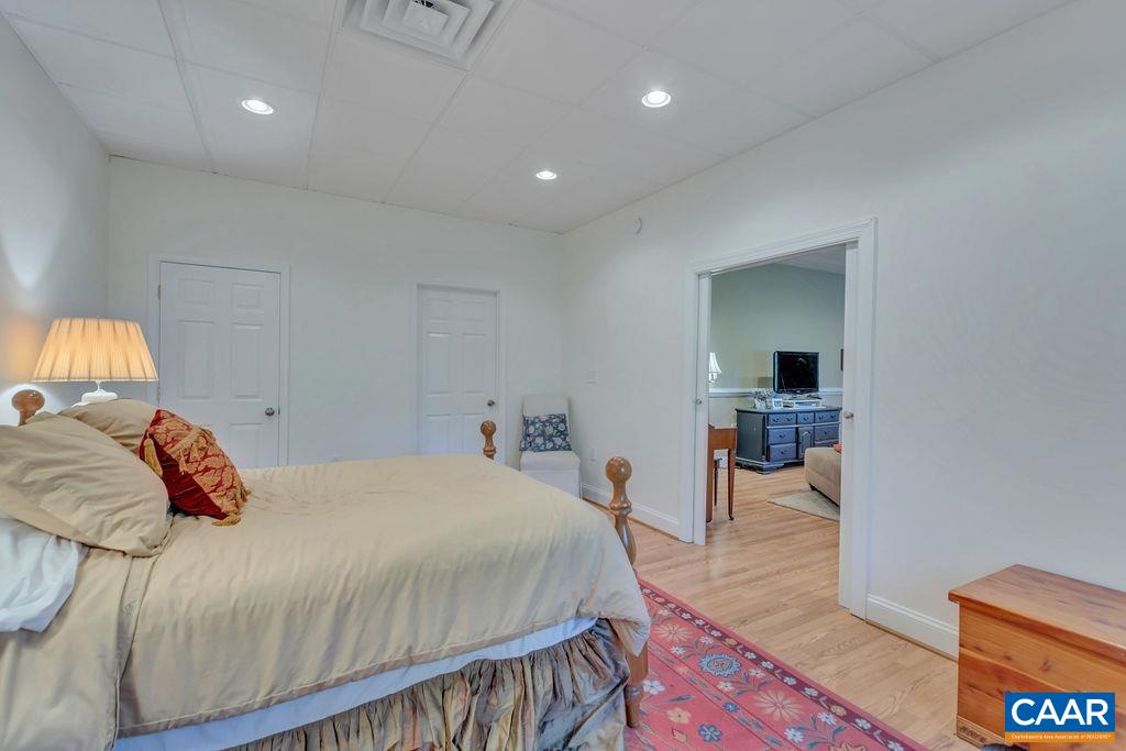 205 Old Stony Ridge Road Afton, VA 22920 - Photo 38 of 70 a bedroom with a bed and a view of living room