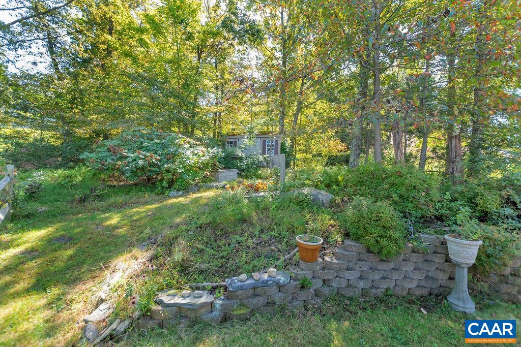 205 Old Stony Ridge Road Afton, VA 22920 - Photo 57 of 70 a view of a garden with plants and large trees