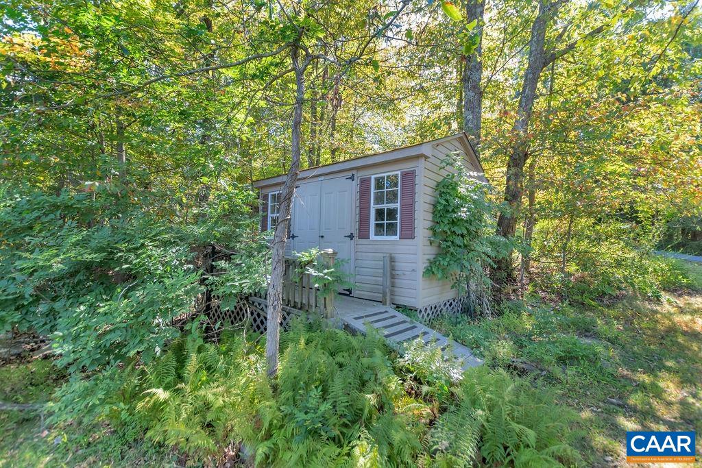 205 Old Stony Ridge Road Afton, VA 22920 - Photo 59 of 70 a view of a backyard with plants and large trees