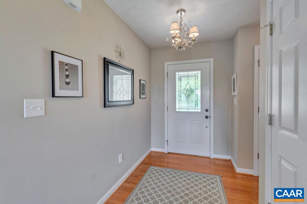 205 Old Stony Ridge Road Afton, VA 22920 - Photo 7 of 70 a view of a hallway with windows and chandelier