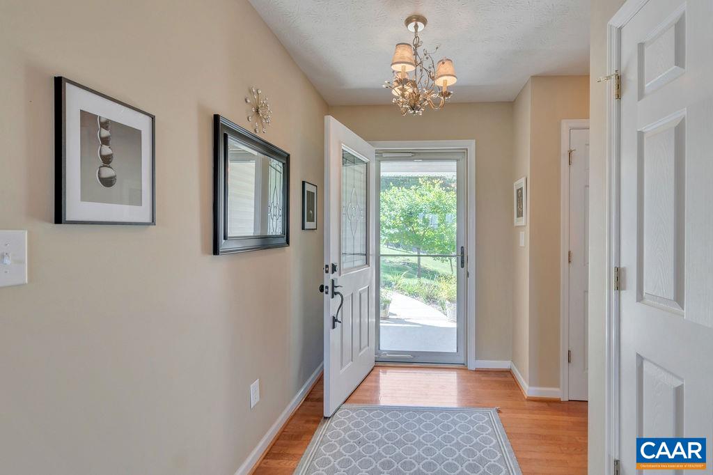 205 Old Stony Ridge Road Afton, VA 22920 - Photo 9 of 70 a view of a hallway with a chandelier