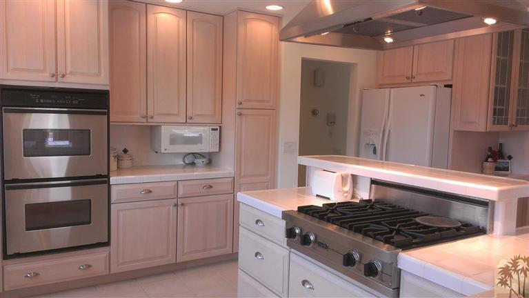 40290 Paseo Del Rey Rancho Mirage, CA 92270 - Photo 11 of 16 a kitchen with white cabinets and appliances