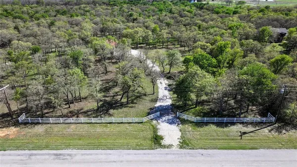 an aerial view of residential house with outdoor space