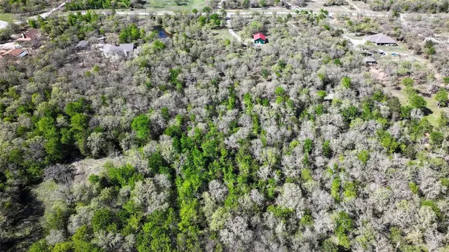 a view of a house with a yard and garage
