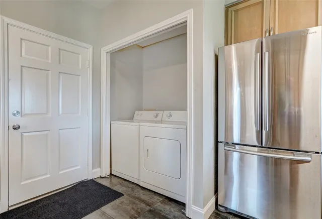 a view of walk in closet with wooden floor