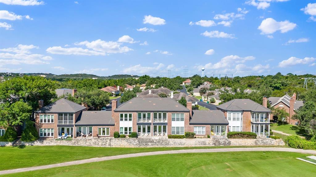 16 Tournament Way The Hills, TX 78738 - Photo 37 of 40 a front view of a house with garden and trees