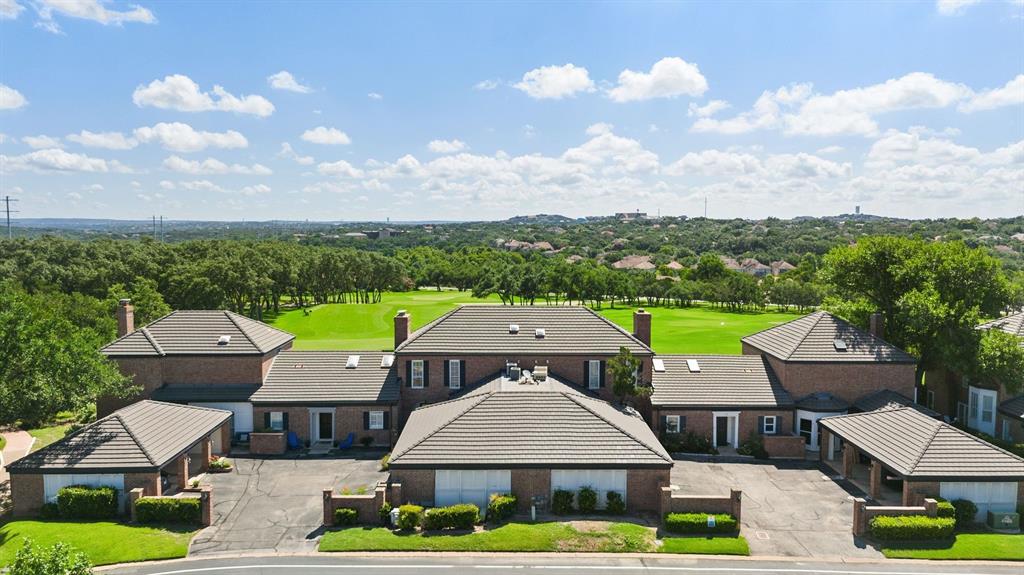 16 Tournament Way The Hills, TX 78738 - Photo 39 of 40 an aerial view of a house with swimming pool and garden