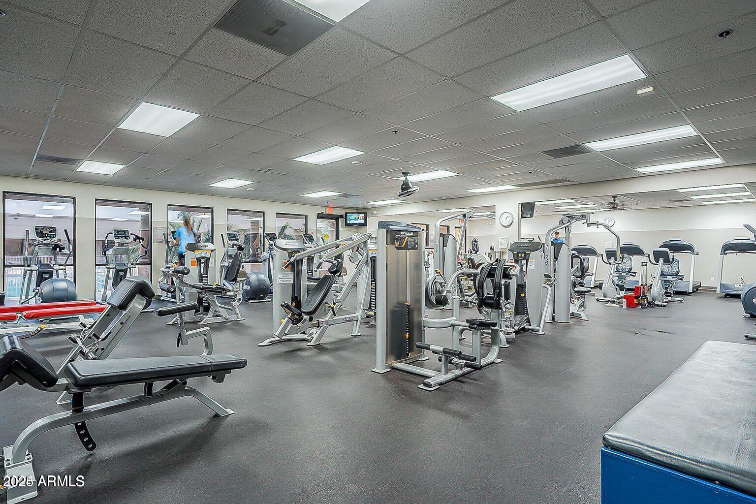 19095 North 97th Lane Peoria, AZ 85382 - Photo 18 of 36 a view of a room with gym equipment