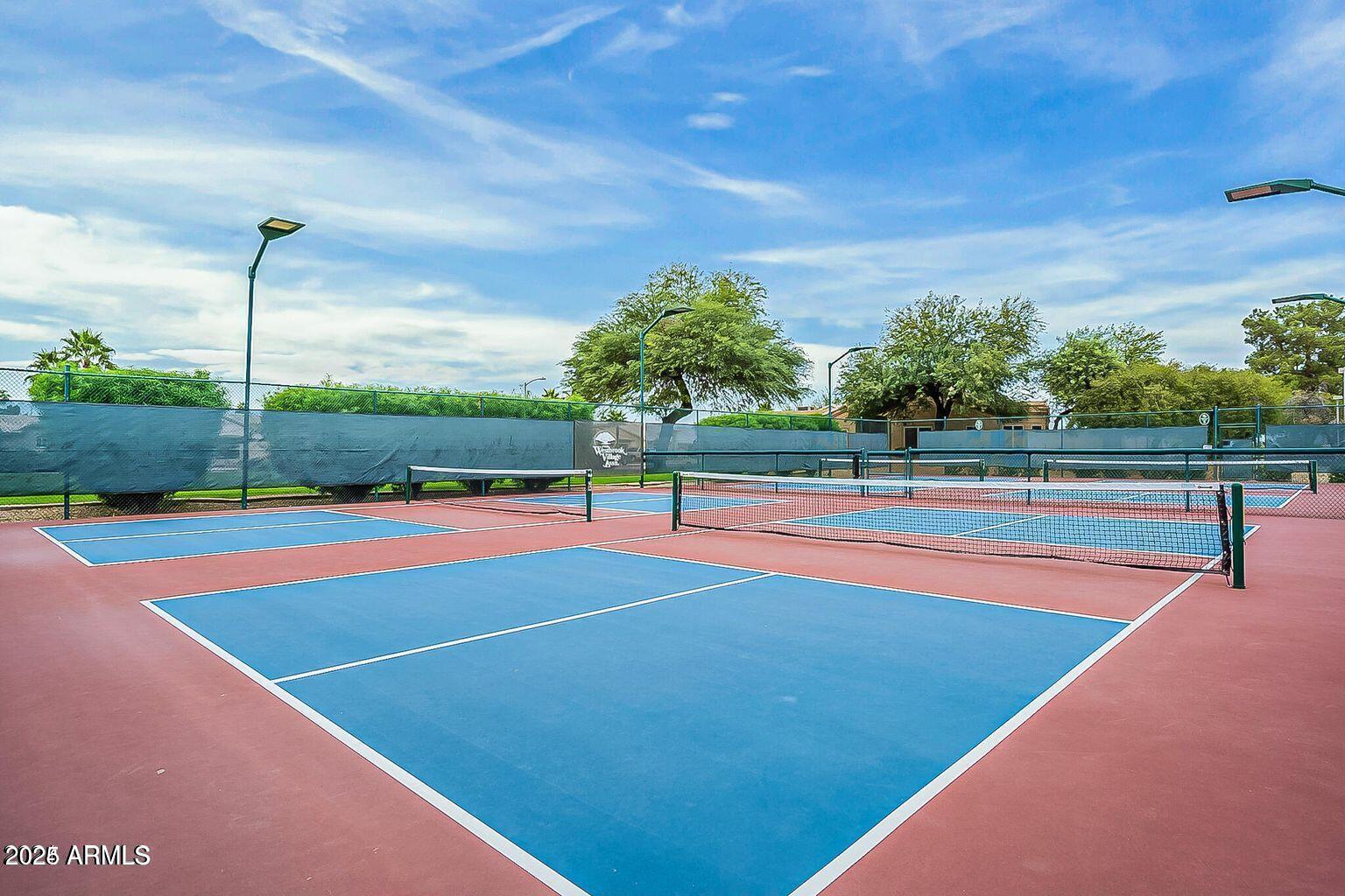 19095 North 97th Lane Peoria, AZ 85382 - Photo 21 of 36 a view of tennis court
