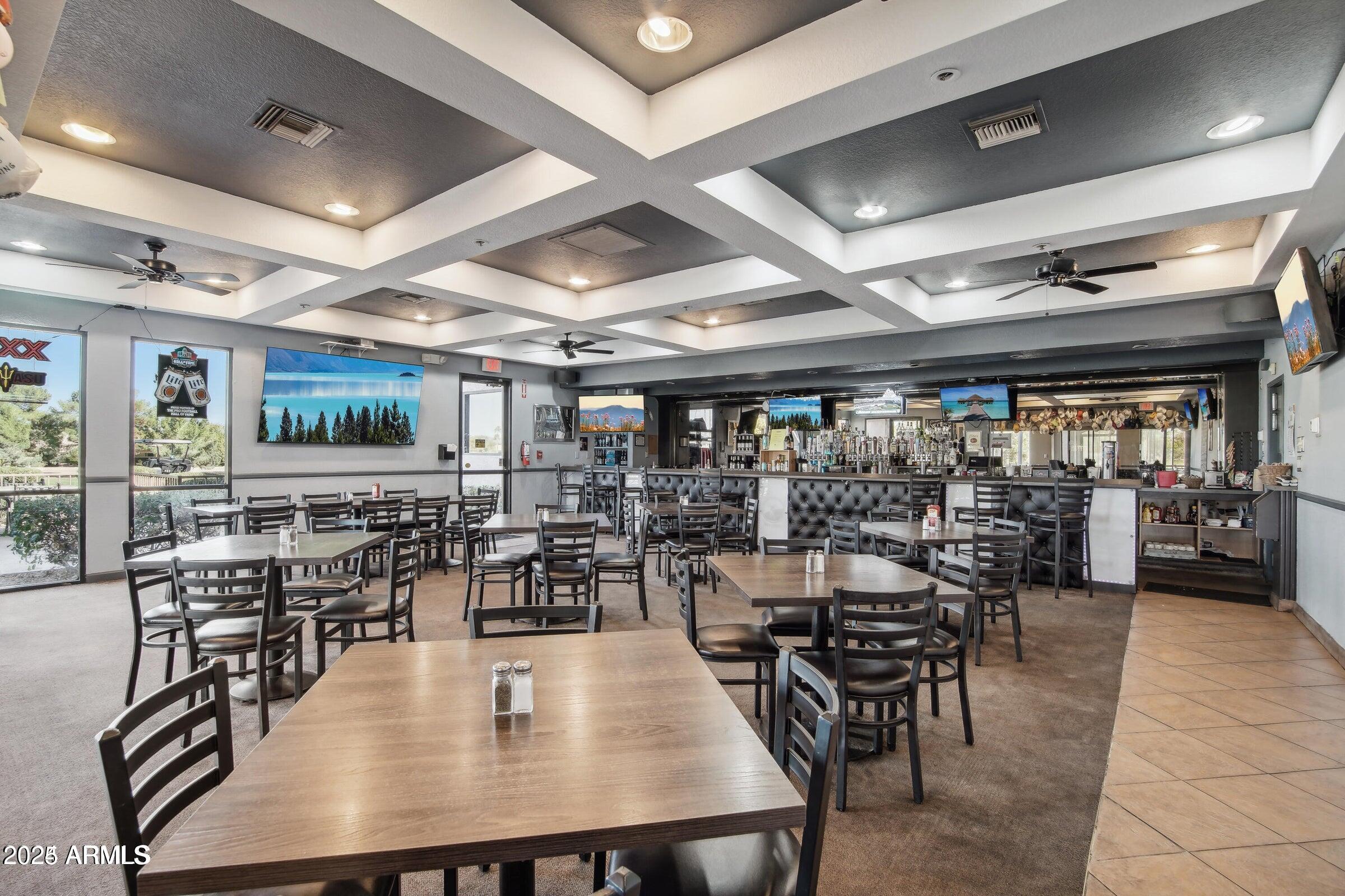 19095 North 97th Lane Peoria, AZ 85382 - Photo 22 of 36 a view of a dining room with furniture