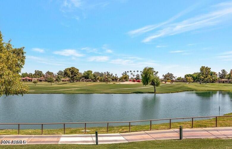 19095 North 97th Lane Peoria, AZ 85382 - Photo 26 of 36 a view of a lake with houses in the back