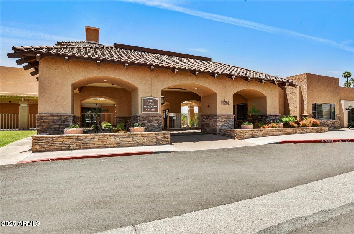 19095 North 97th Lane Peoria, AZ 85382 - Photo 29 of 36 a view of a building with a pathway