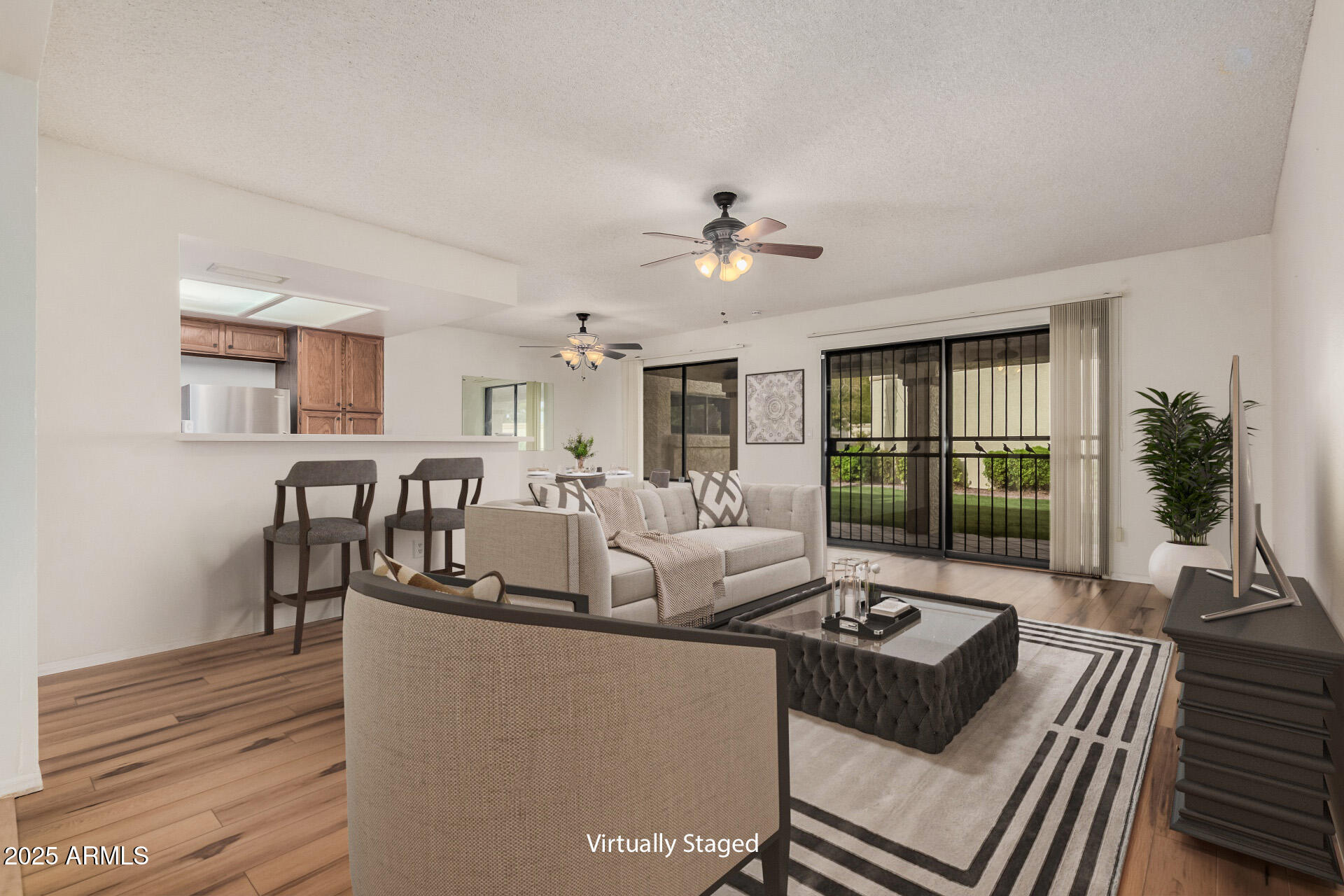 19095 North 97th Lane Peoria, AZ 85382 - Photo 2 of 36 a living room with furniture
