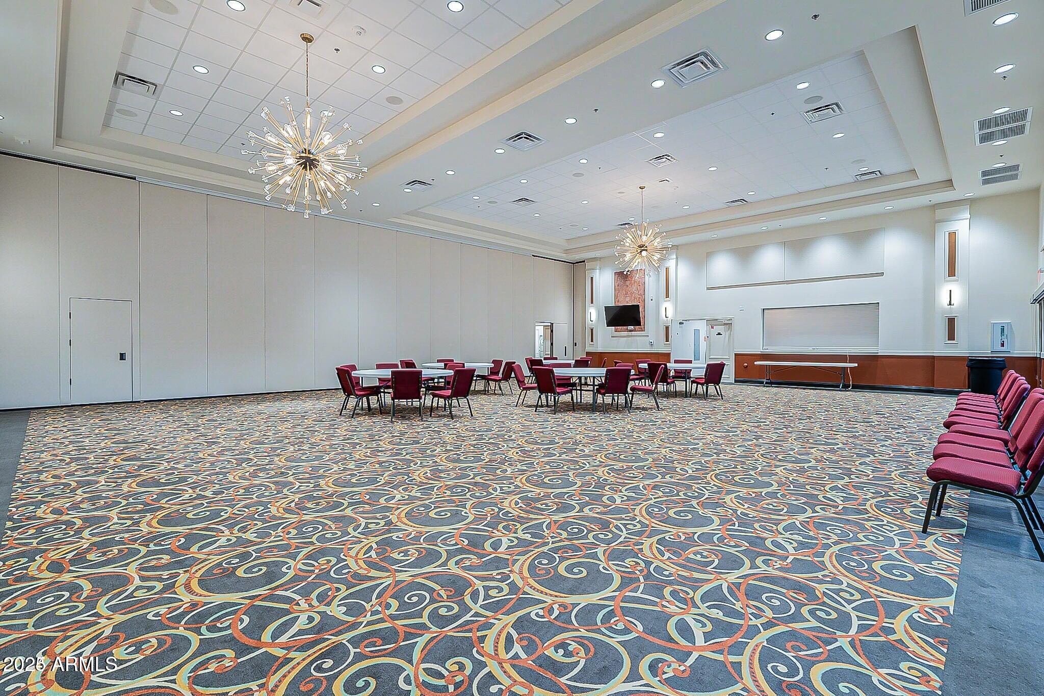 19095 North 97th Lane Peoria, AZ 85382 - Photo 31 of 36 a room with furniture and a chandelier