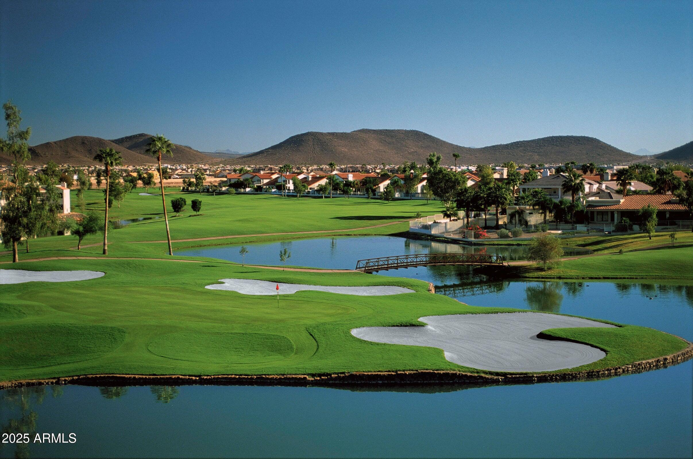 19095 North 97th Lane Peoria, AZ 85382 - Photo 35 of 36 a view of a golf course with a lake view