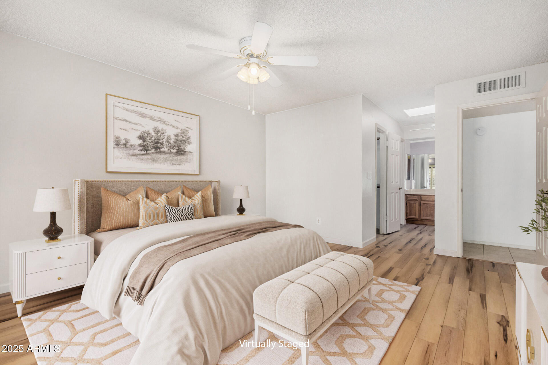 19095 North 97th Lane Peoria, AZ 85382 - Photo 6 of 36 a bedroom with a bed and a chandelier