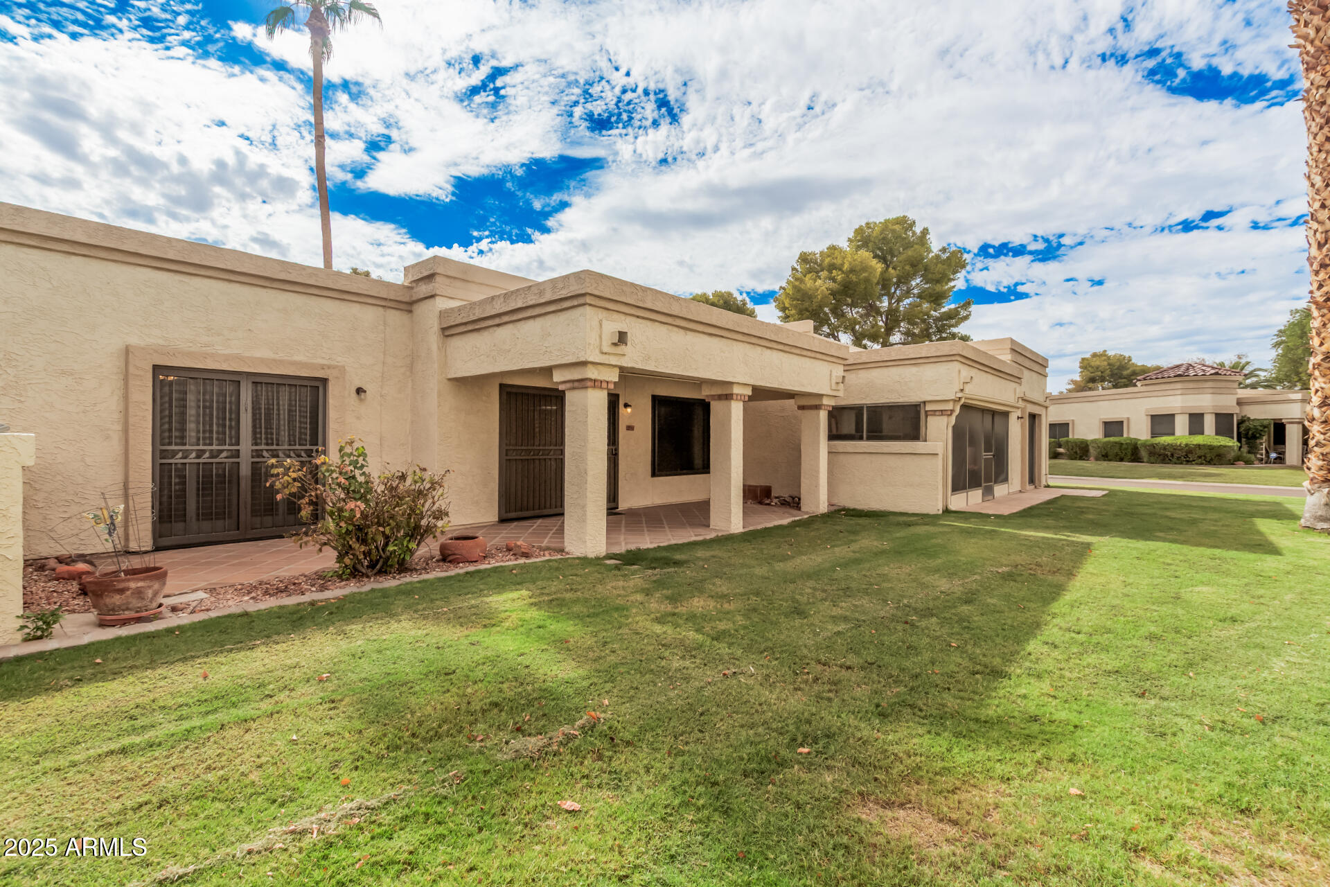 19095 North 97th Lane Peoria, AZ 85382 - Photo 8 of 36 a front view of a house with a yard