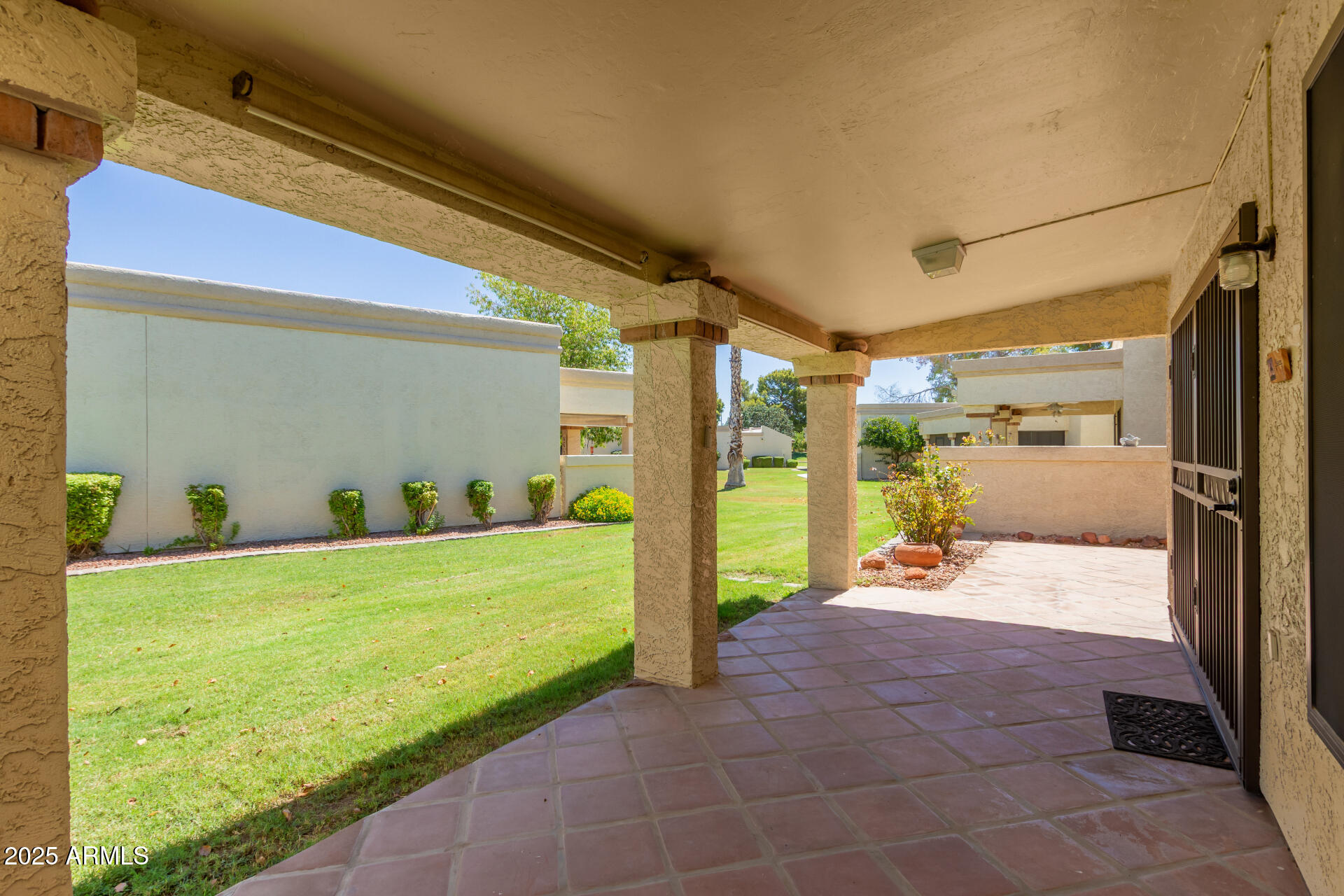 19095 North 97th Lane Peoria, AZ 85382 - Photo 9 of 36 a view of a porch with seating space