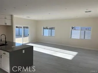 a kitchen with granite countertop a sink and a stove