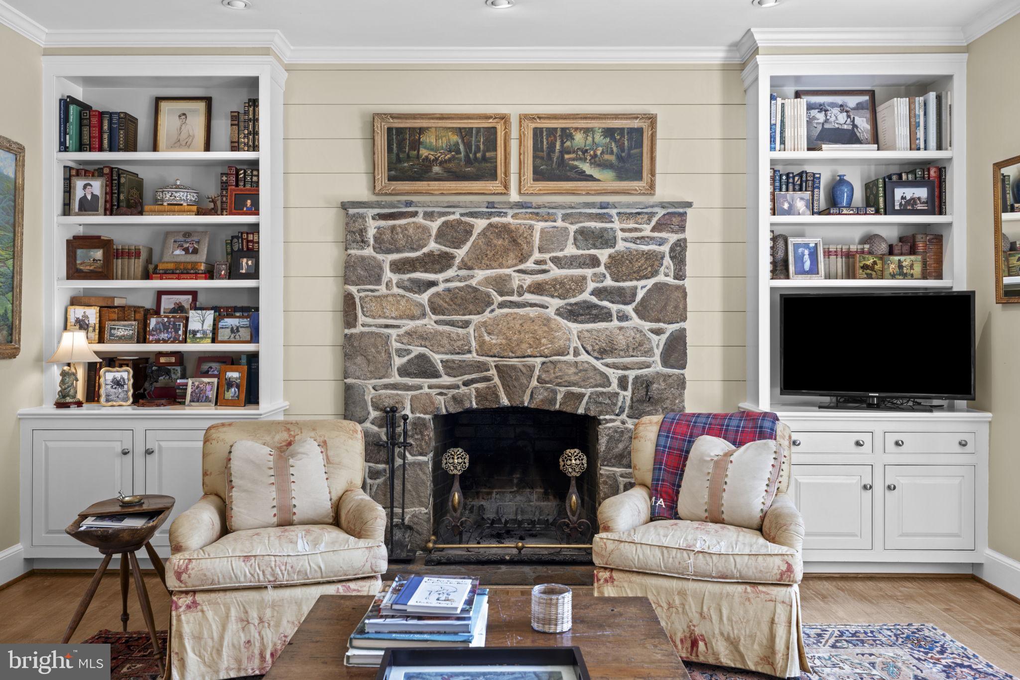 36190 Turkey Roost Road Middleburg, VA 20117 - Photo 33 of 88 a living room with furniture and a flat screen tv
