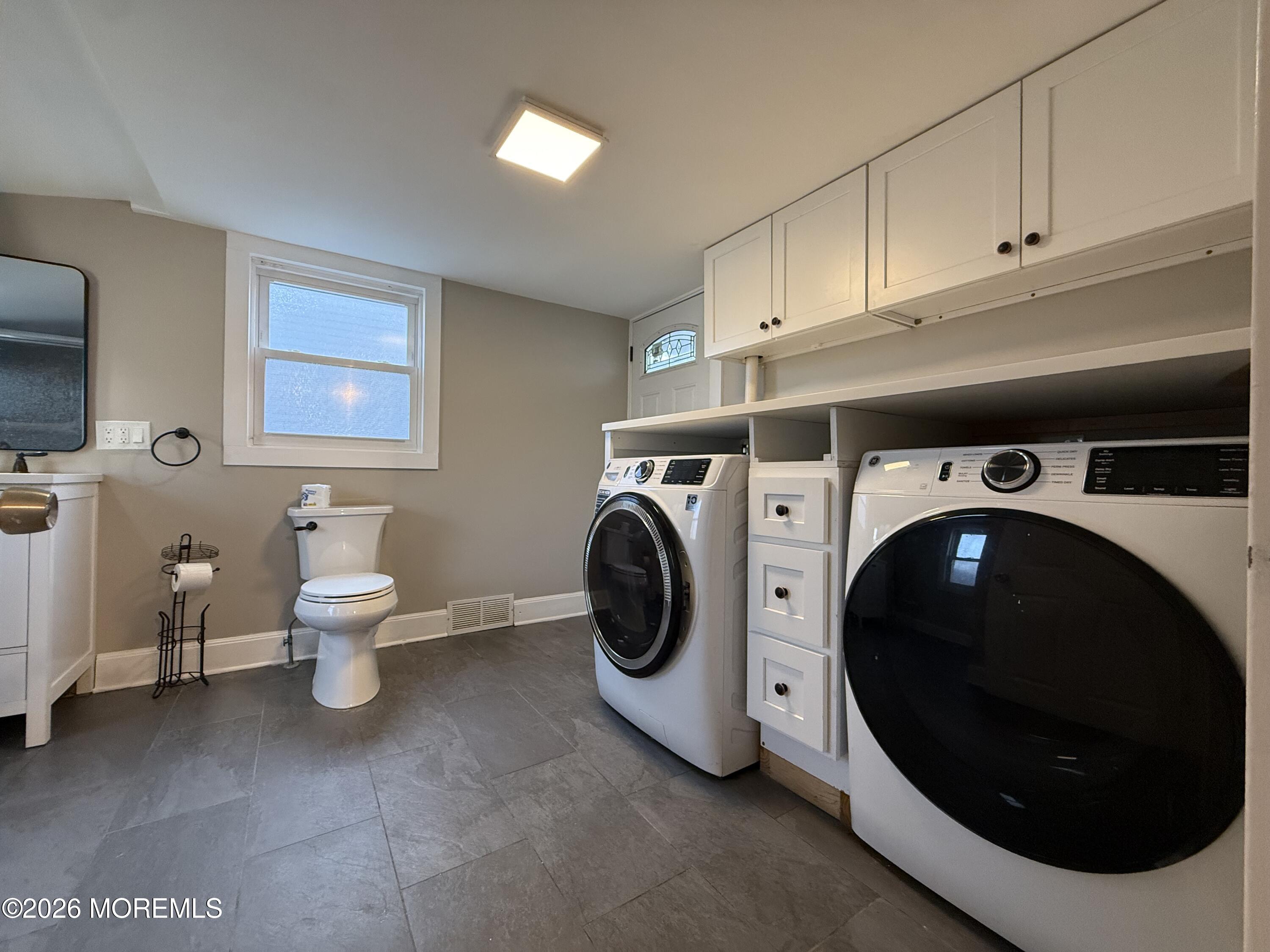 30 Conover Street Freehold, NJ 07728 - Photo 13 of 38 a utility room with dryer and washer