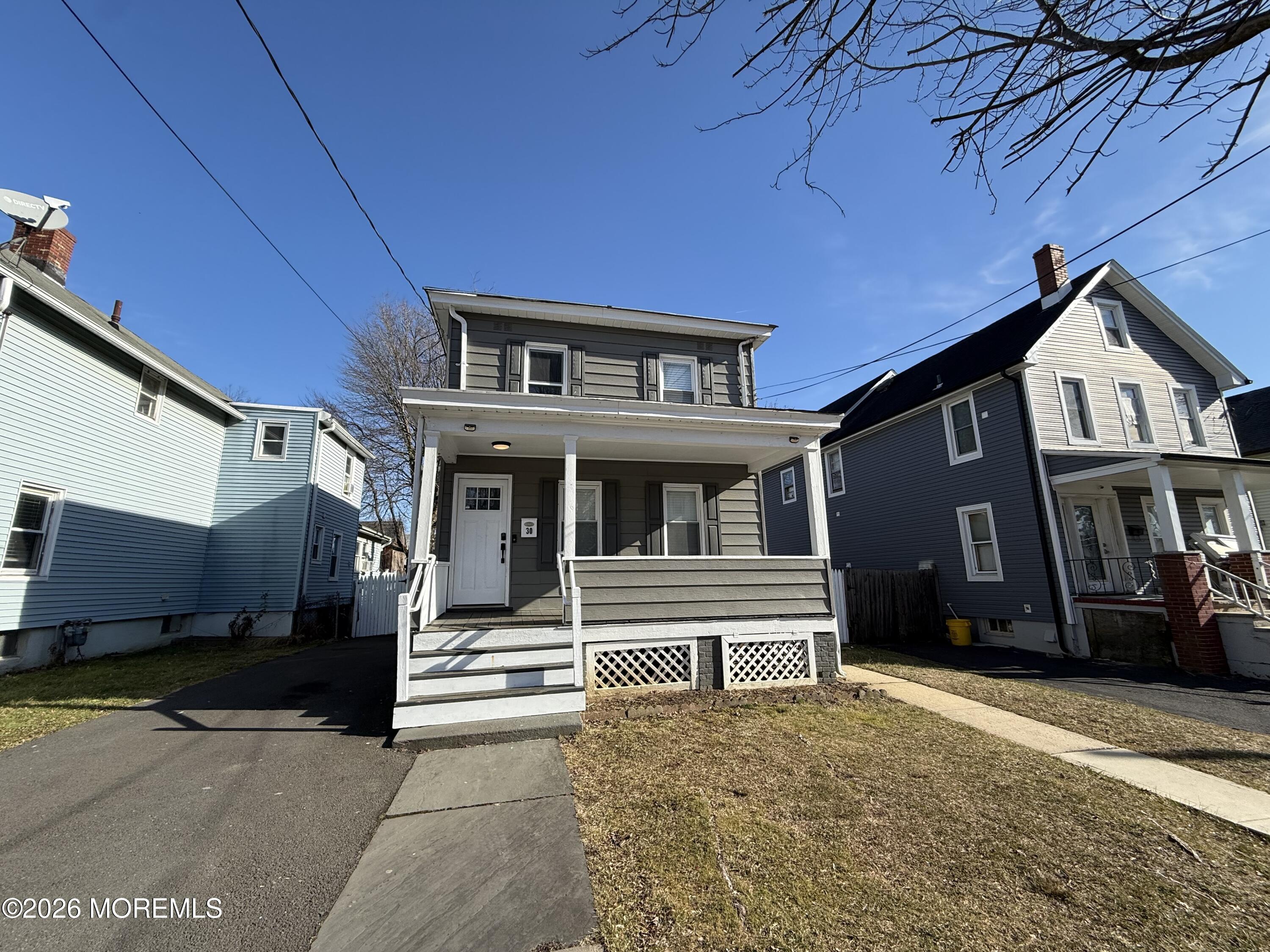 30 Conover Street Freehold, NJ 07728 - Photo 2 of 38 a front view of a house with a garage