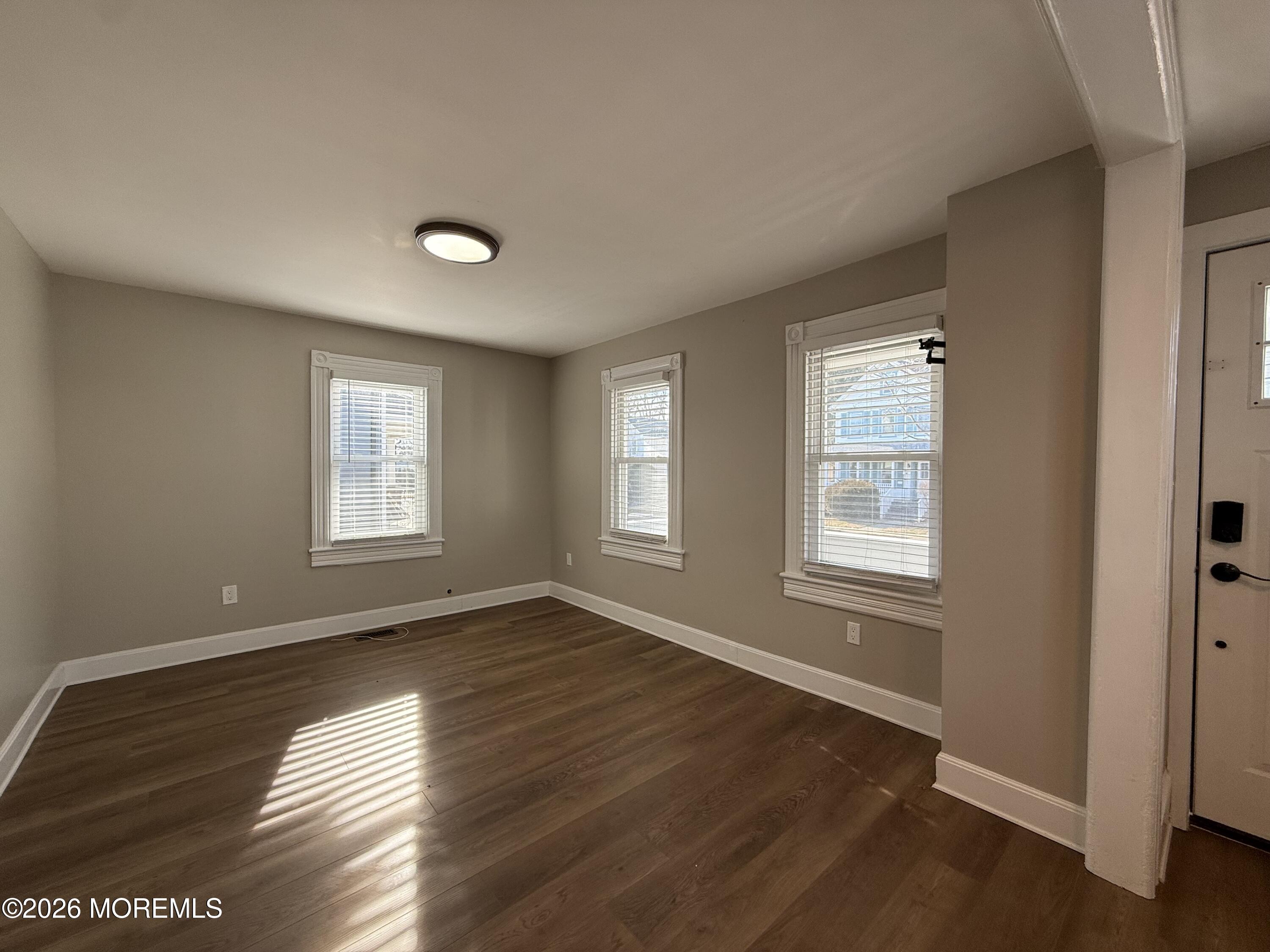 30 Conover Street Freehold, NJ 07728 - Photo 23 of 38 a view of an empty room with wooden floor and a window