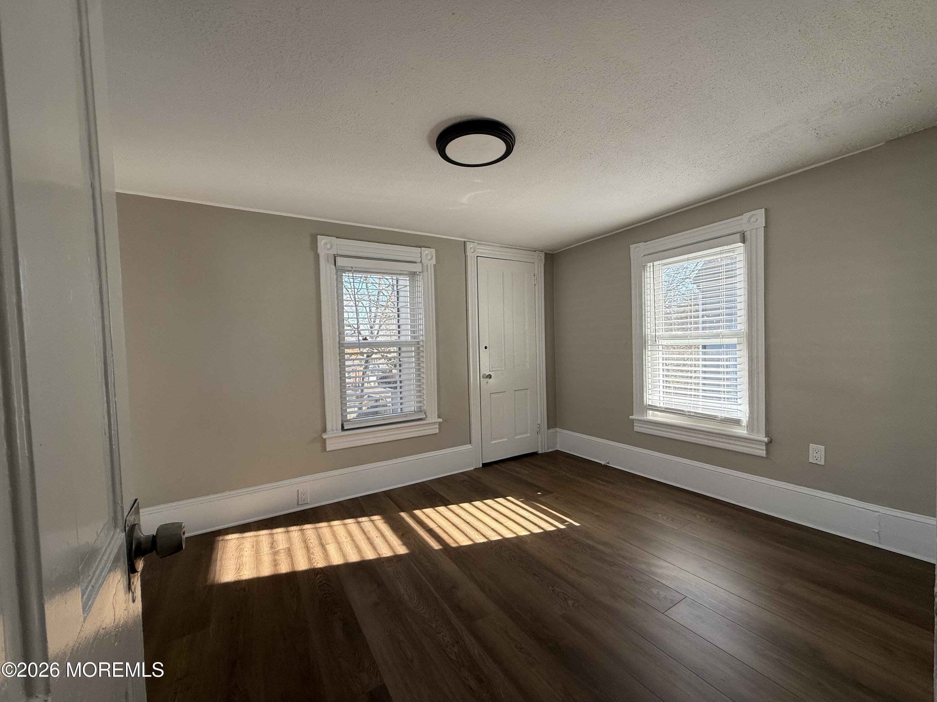 30 Conover Street Freehold, NJ 07728 - Photo 25 of 38 a view of an empty room with wooden floor and a window