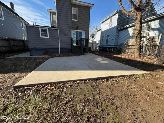 a view of a backyard of the house