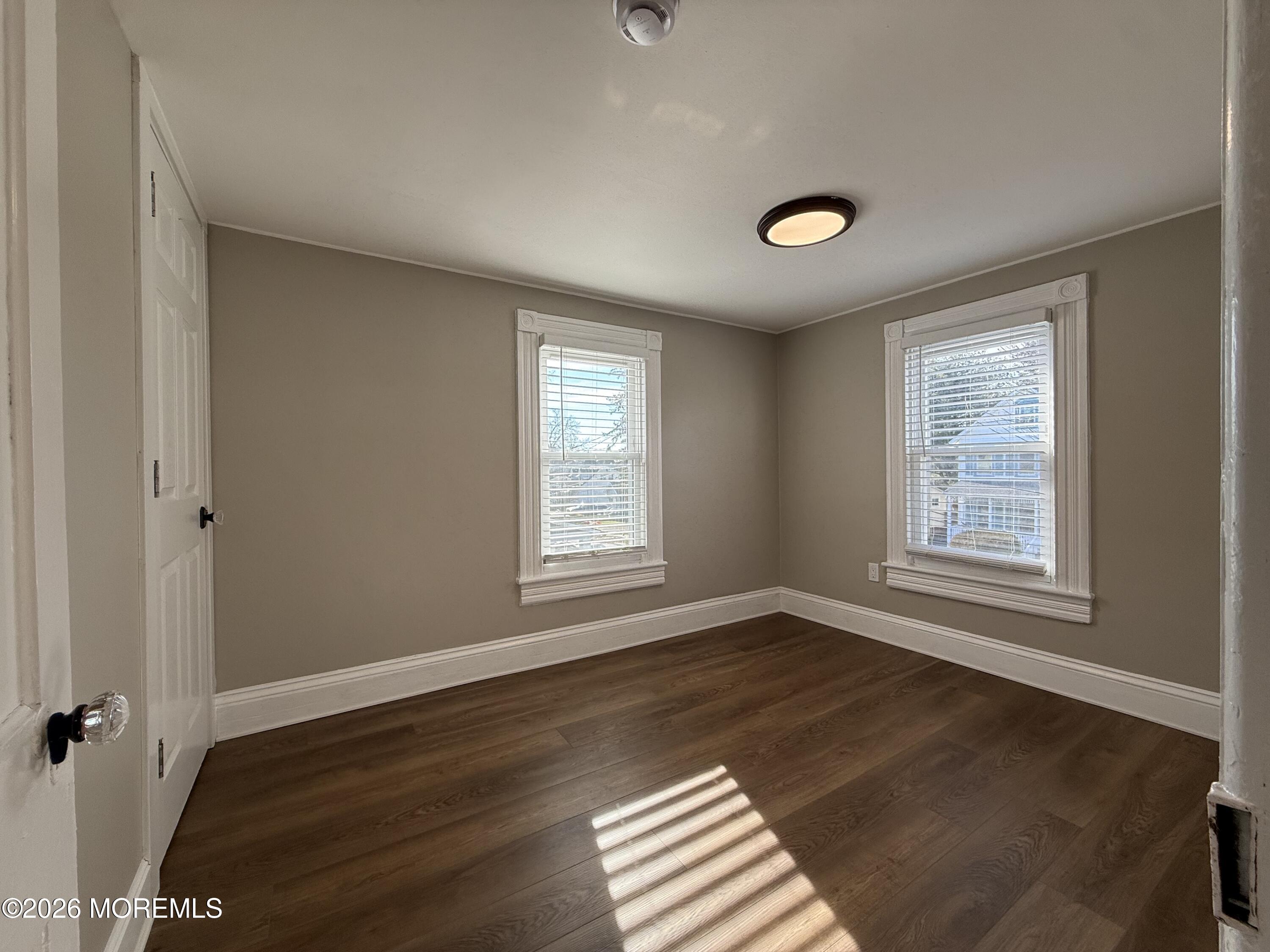 30 Conover Street Freehold, NJ 07728 - Photo 27 of 38 a view of an empty room with wooden floor and a window