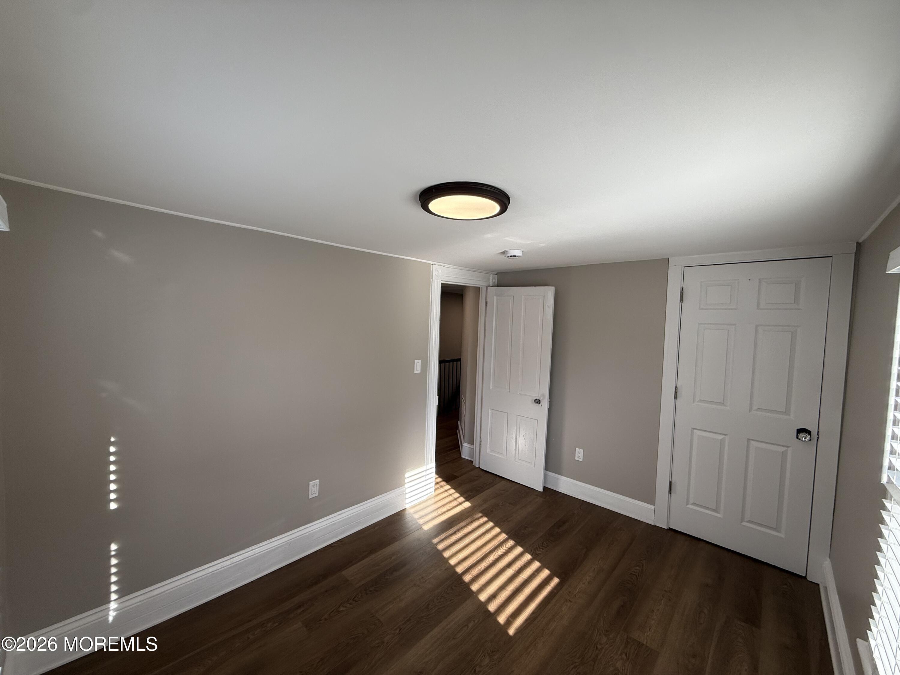 30 Conover Street Freehold, NJ 07728 - Photo 28 of 38 a view of empty room with wooden floor
