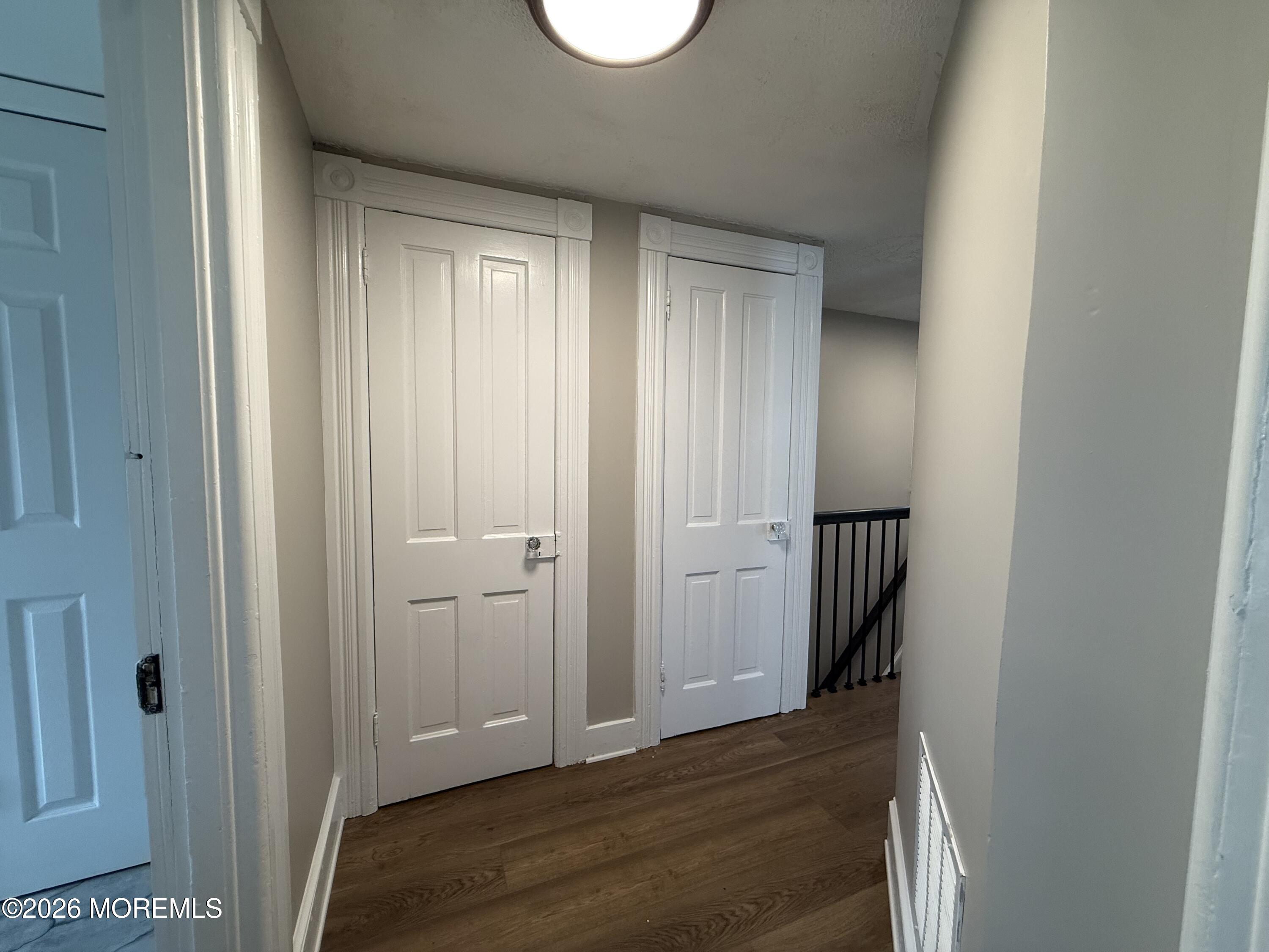 30 Conover Street Freehold, NJ 07728 - Photo 33 of 38 a view of a hallway with wooden floor and closet area