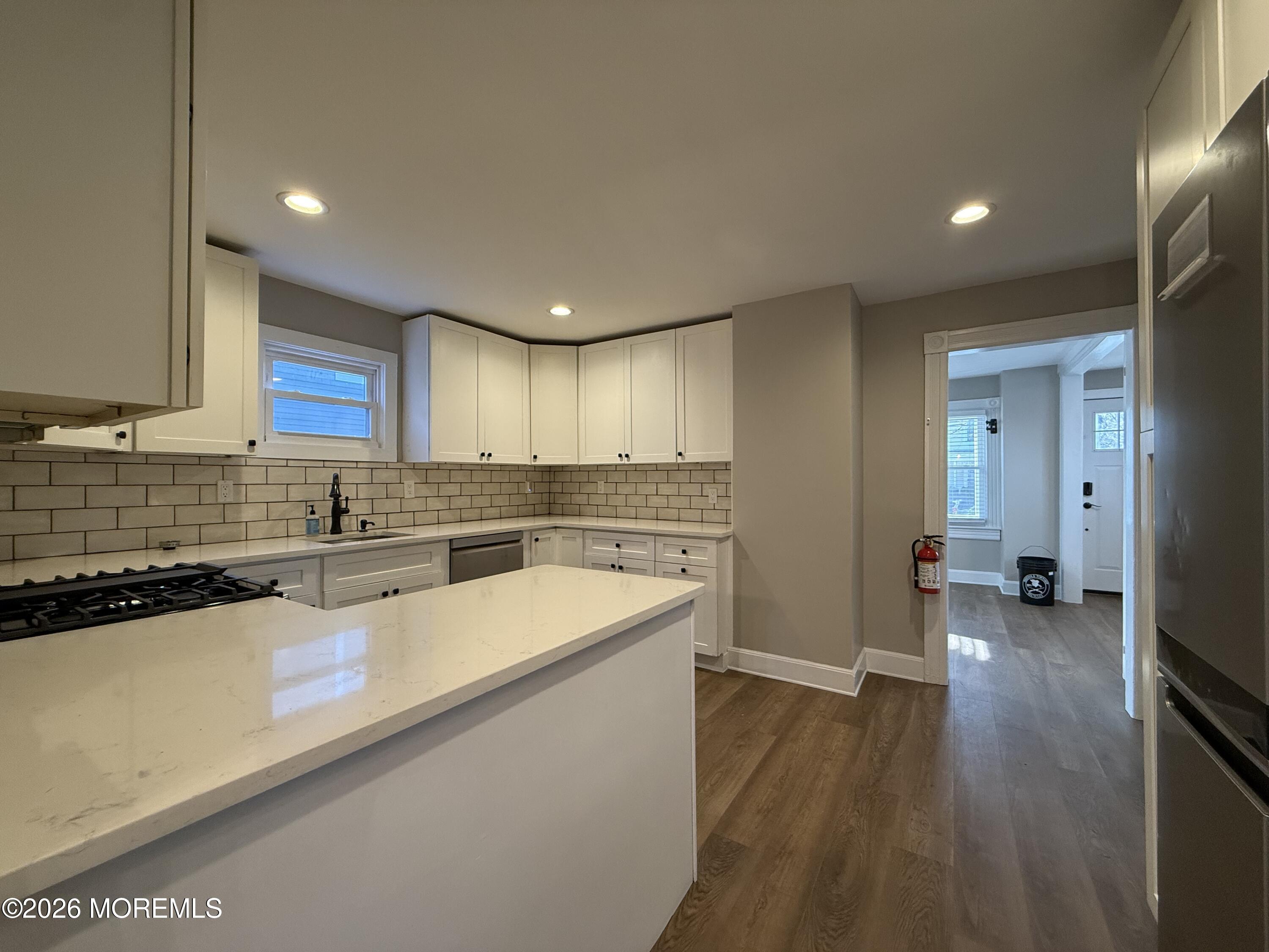 30 Conover Street Freehold, NJ 07728 - Photo 8 of 38 a view of a kitchen with a sink and cabinets