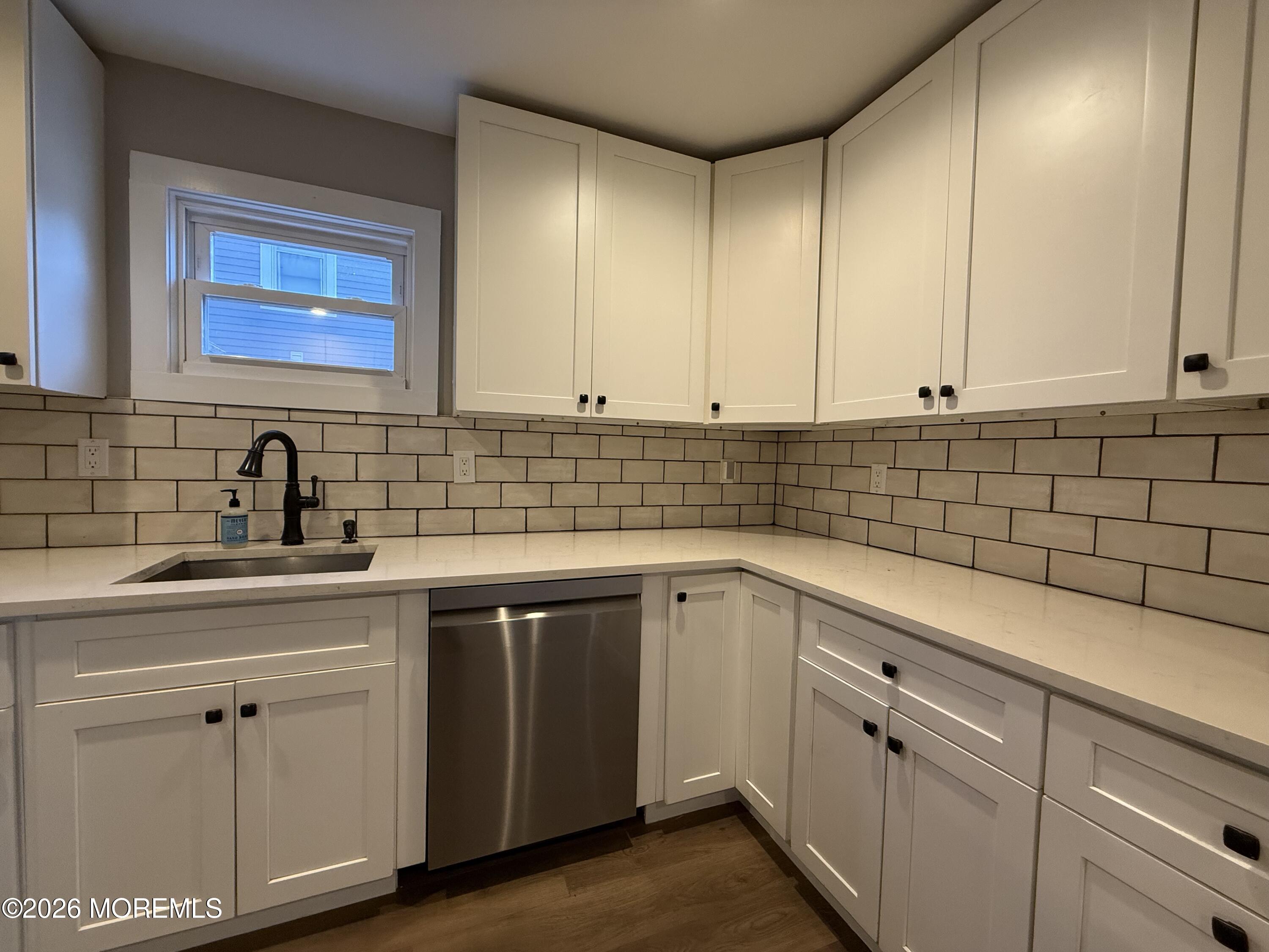 30 Conover Street Freehold, NJ 07728 - Photo 10 of 38 a kitchen with a sink cabinets and window