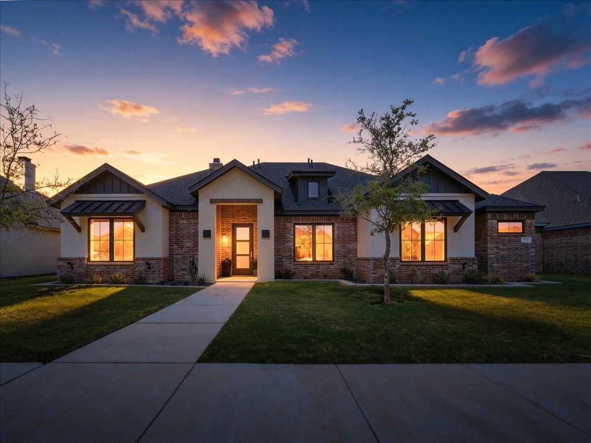 4506 140th Street Lubbock, TX 79424 - Photo 1 of 62 a front view of a house with a yard and garage