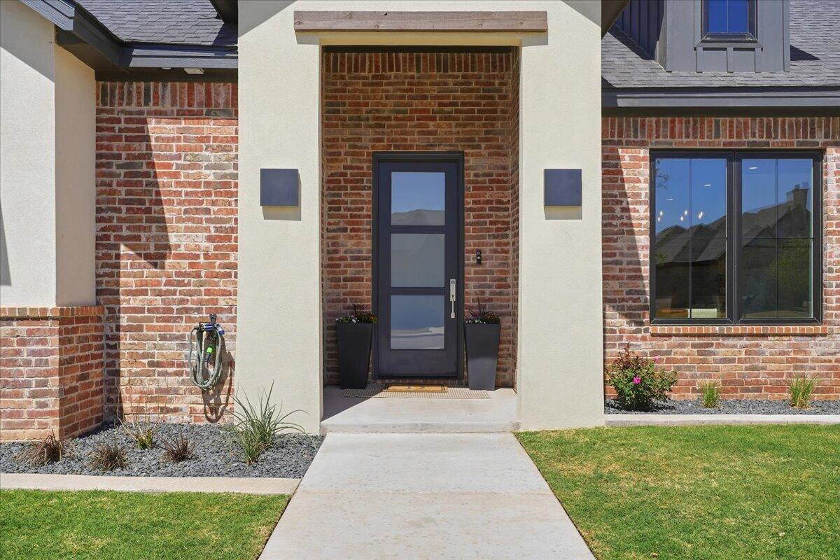 4506 140th Street Lubbock, TX 79424 - Photo 14 of 62 a view of front door of house with yard