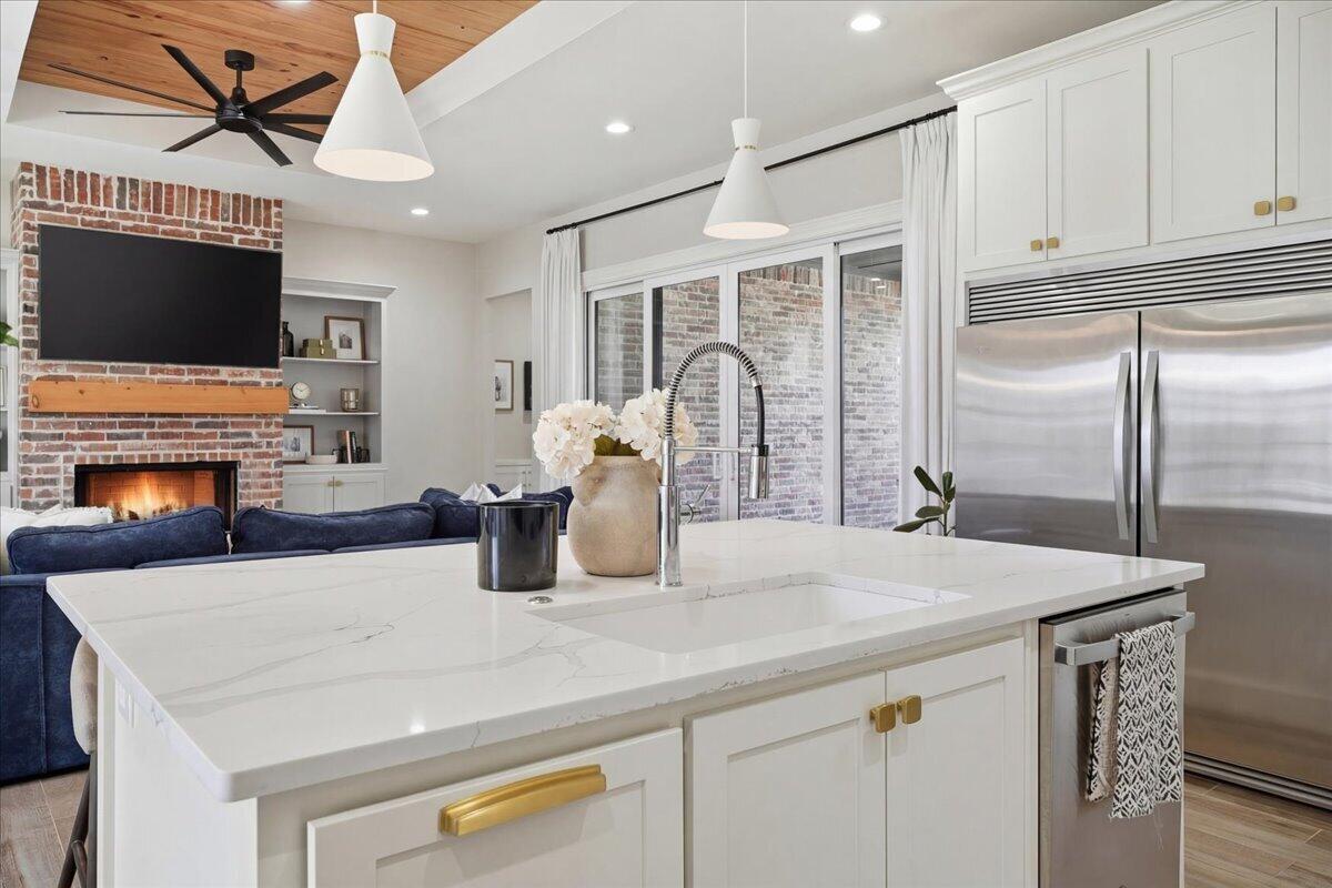 4506 140th Street Lubbock, TX 79424 - Photo 24 of 62 a kitchen with a refrigerator a stove and a microwave