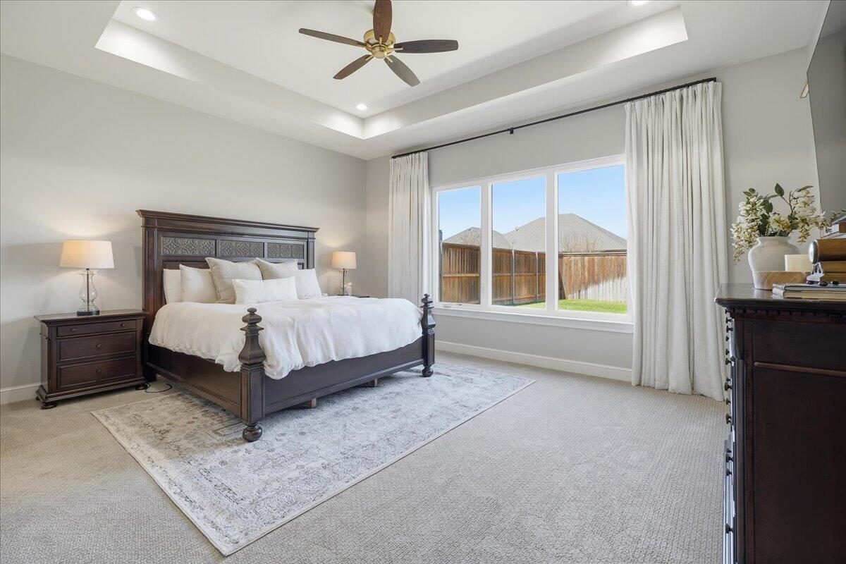 4506 140th Street Lubbock, TX 79424 - Photo 28 of 62 a bedroom with a bed and a window