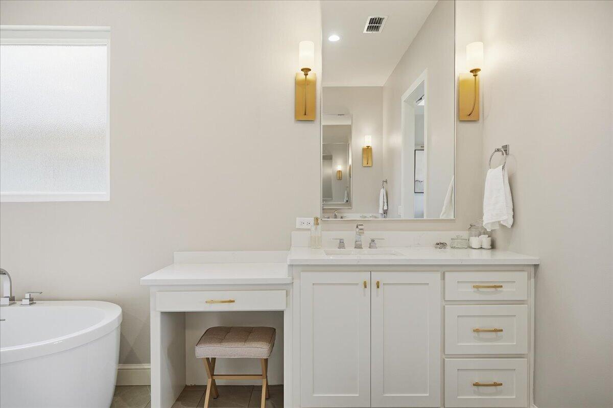 4506 140th Street Lubbock, TX 79424 - Photo 32 of 62 a bathroom with a sink and a mirror