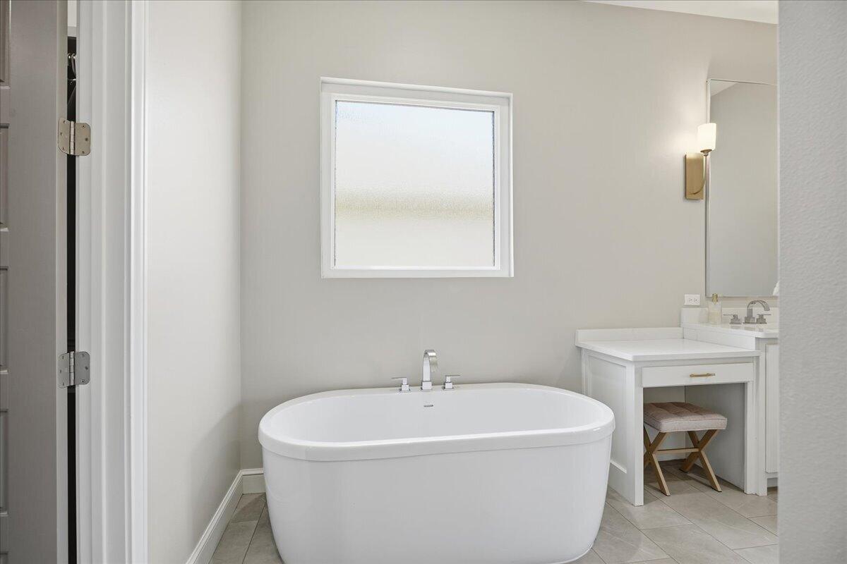 4506 140th Street Lubbock, TX 79424 - Photo 34 of 62 a white bath tub sitting next to a white sink