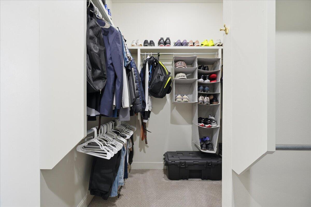 4506 140th Street Lubbock, TX 79424 - Photo 37 of 62 a view of walk in closet with clothes and shoes