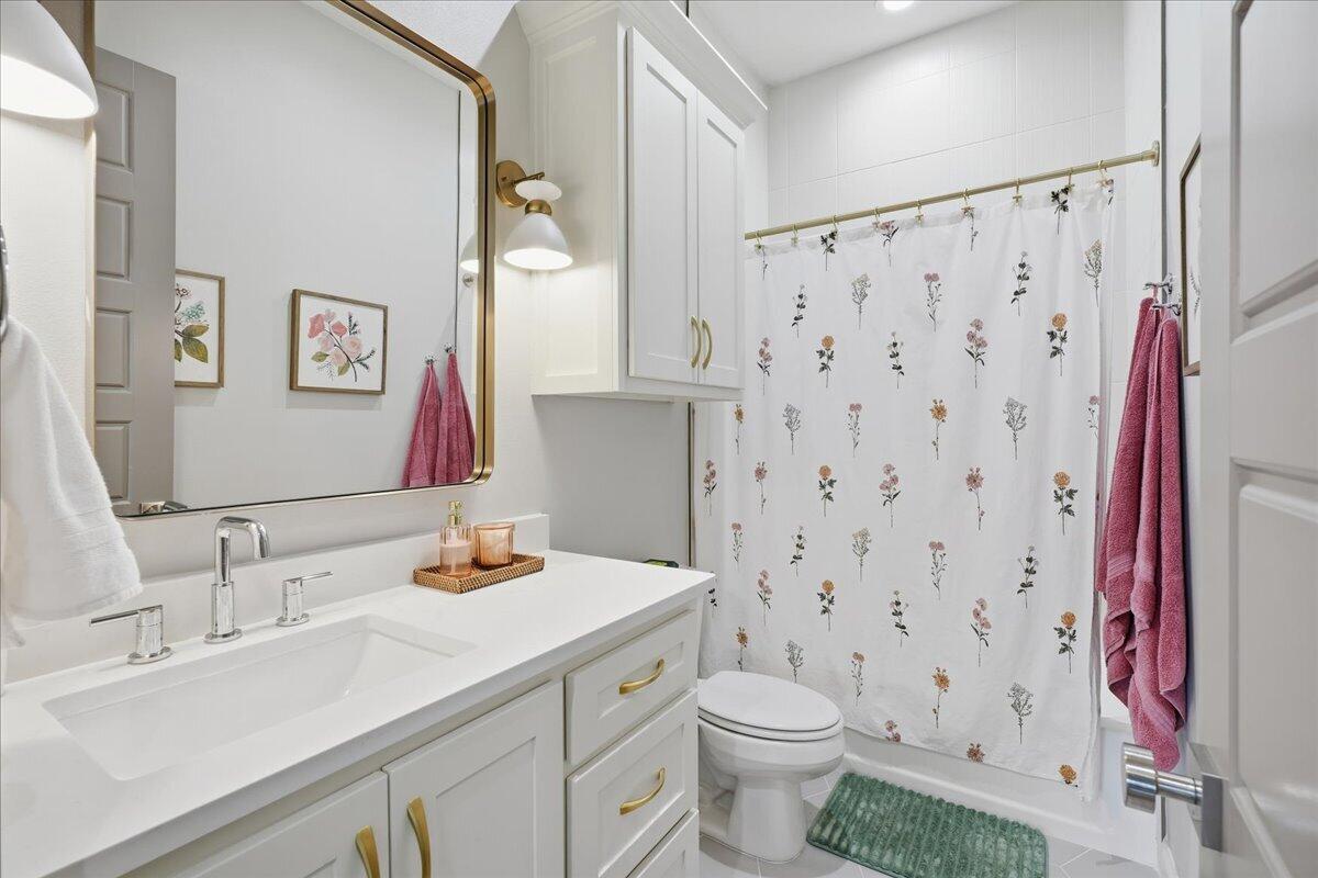 4506 140th Street Lubbock, TX 79424 - Photo 38 of 62 a bathroom with a sink toilet and shower