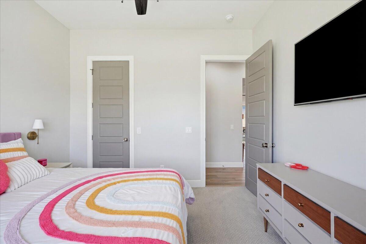 4506 140th Street Lubbock, TX 79424 - Photo 40 of 62 a bedroom with bed and flat screen tv