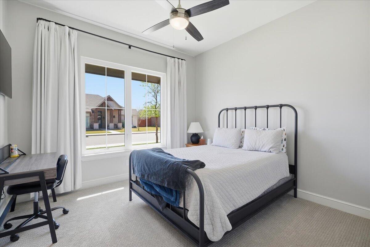 4506 140th Street Lubbock, TX 79424 - Photo 42 of 62 a bedroom with a bed and a window