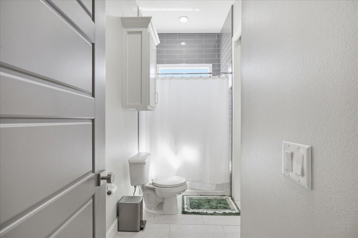 4506 140th Street Lubbock, TX 79424 - Photo 45 of 62 a bathroom with a toilet and a sink